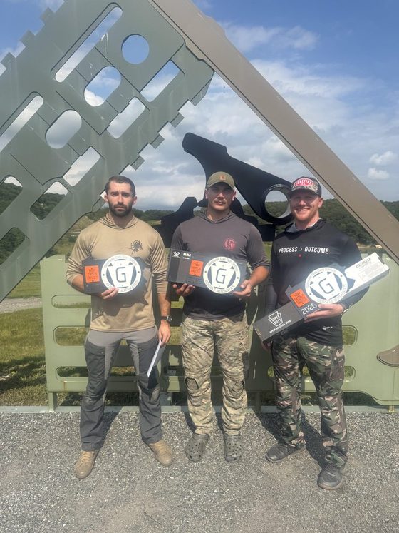 Shaun Muller with two other shooters holding trophies